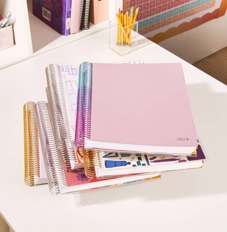 view of stacked teacher planners with different designs